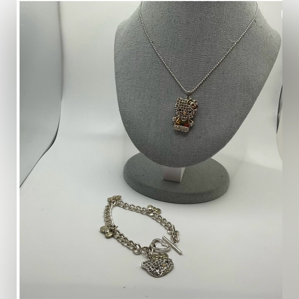 Sanrio: Hello Kitty 8” inch charms bracelet and 18”inch  necklace set. Vintage .